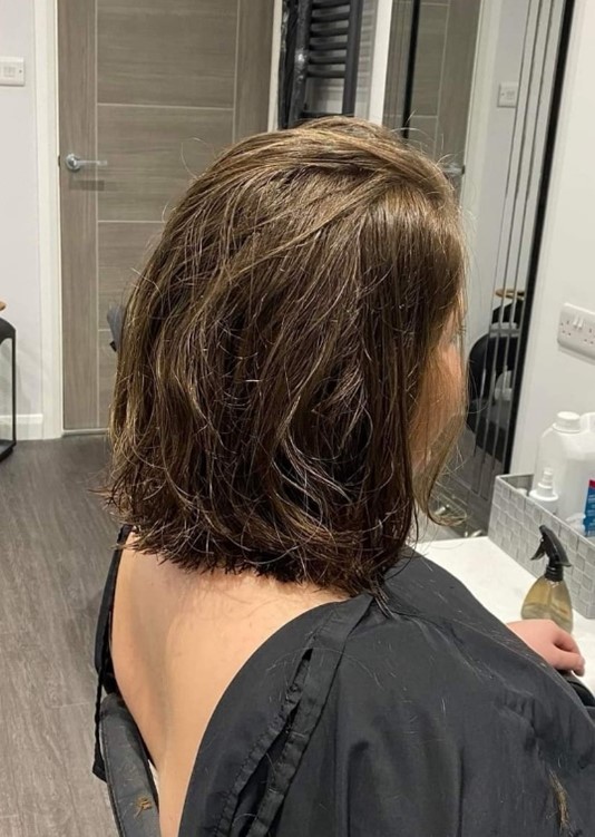 Covers employee’s charity hair chop  raises more than £2,000